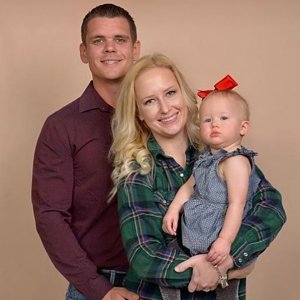 Dustin with his wife & daughter.