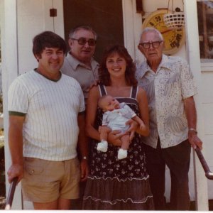my grandfather, Meredith Sherman Hughes (1918 - 1988), is in the left behind my father and my sister